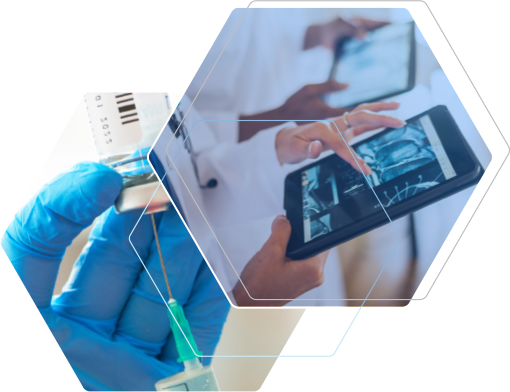 A woman wearing a lab coat and protective gear examines the contents of two vials and two medical professionals reviewing data on tablets